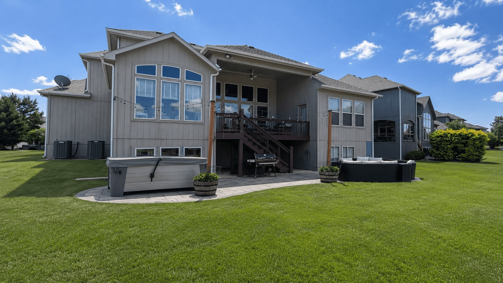 Existing Grabill backyard patio and rear exterior before the outdoor living concept